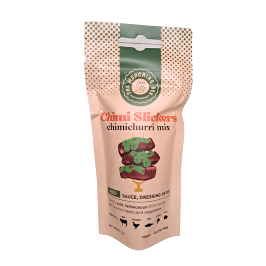 chimichurri sauce mix displayed in a glass jar, showcasing a vibrant green herbal blend with chopped parsley, garlic, and red pepper flakes. The mix promises to bring zesty and flavorful South American flair to your dishes."